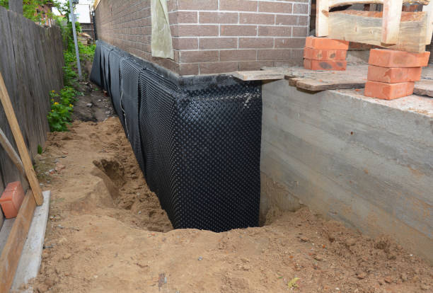 Happy homeowners after waterproofing job in Tipp City